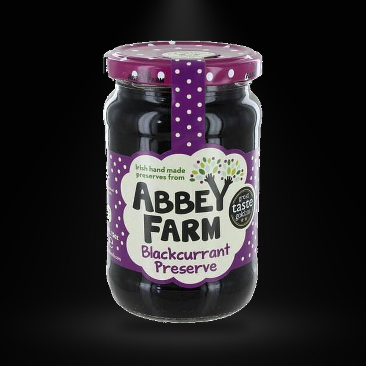Abbey Farm Blackcurrant Jam on a black background with an overhead spotlight