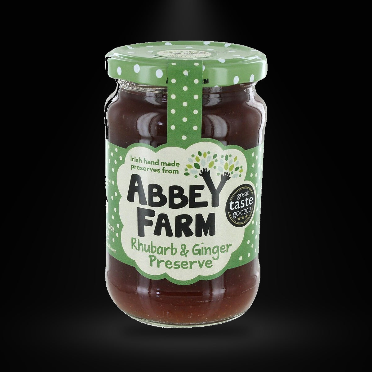 Abbey Farm Rhubarb & Ginger Jam on a black background with an overhead spotlight