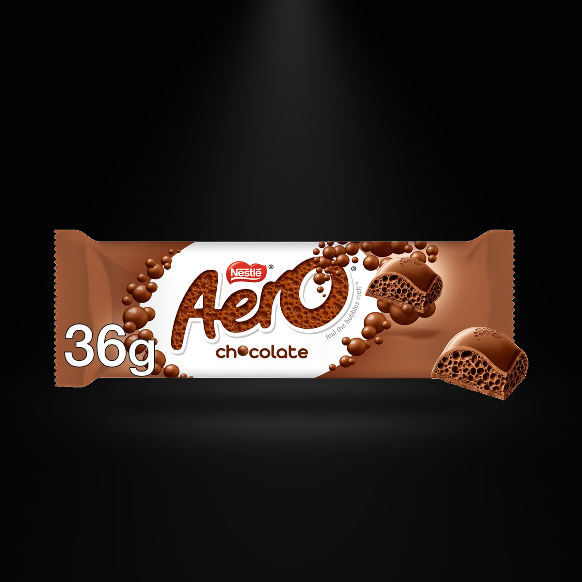 Aero Milk Chocolate Bar 36g on a black background with an overhead spotlight