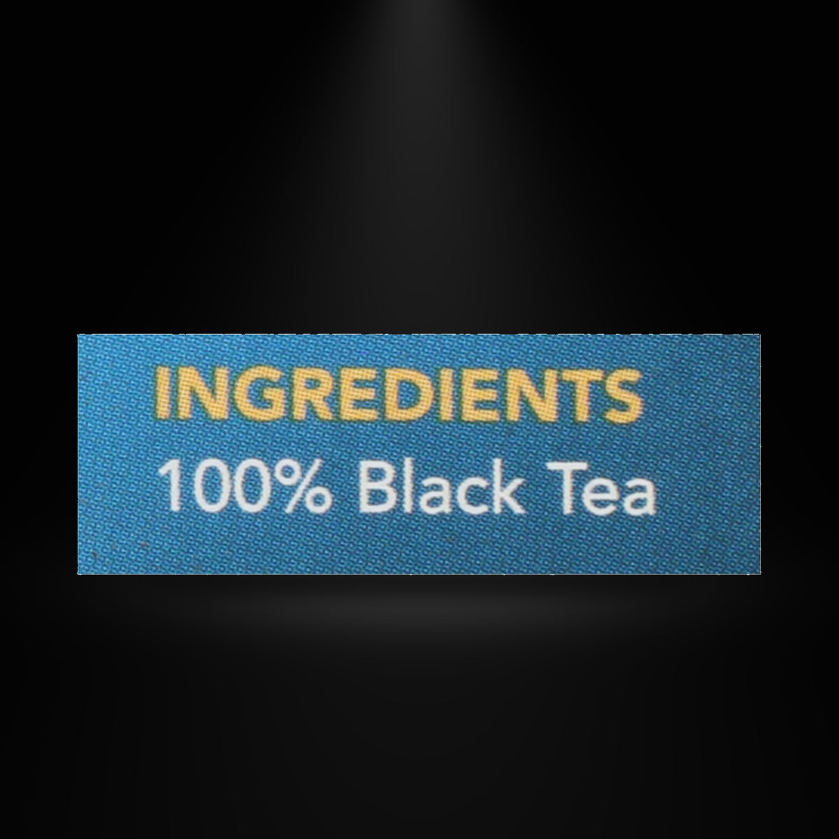 Barrys Tea Decaf 40ct on a black background with an overhead spotlight
