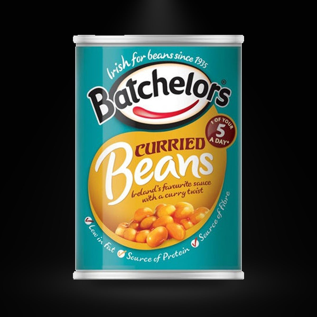 Batchelors Curried Beans on a black background with an overhead spotlight