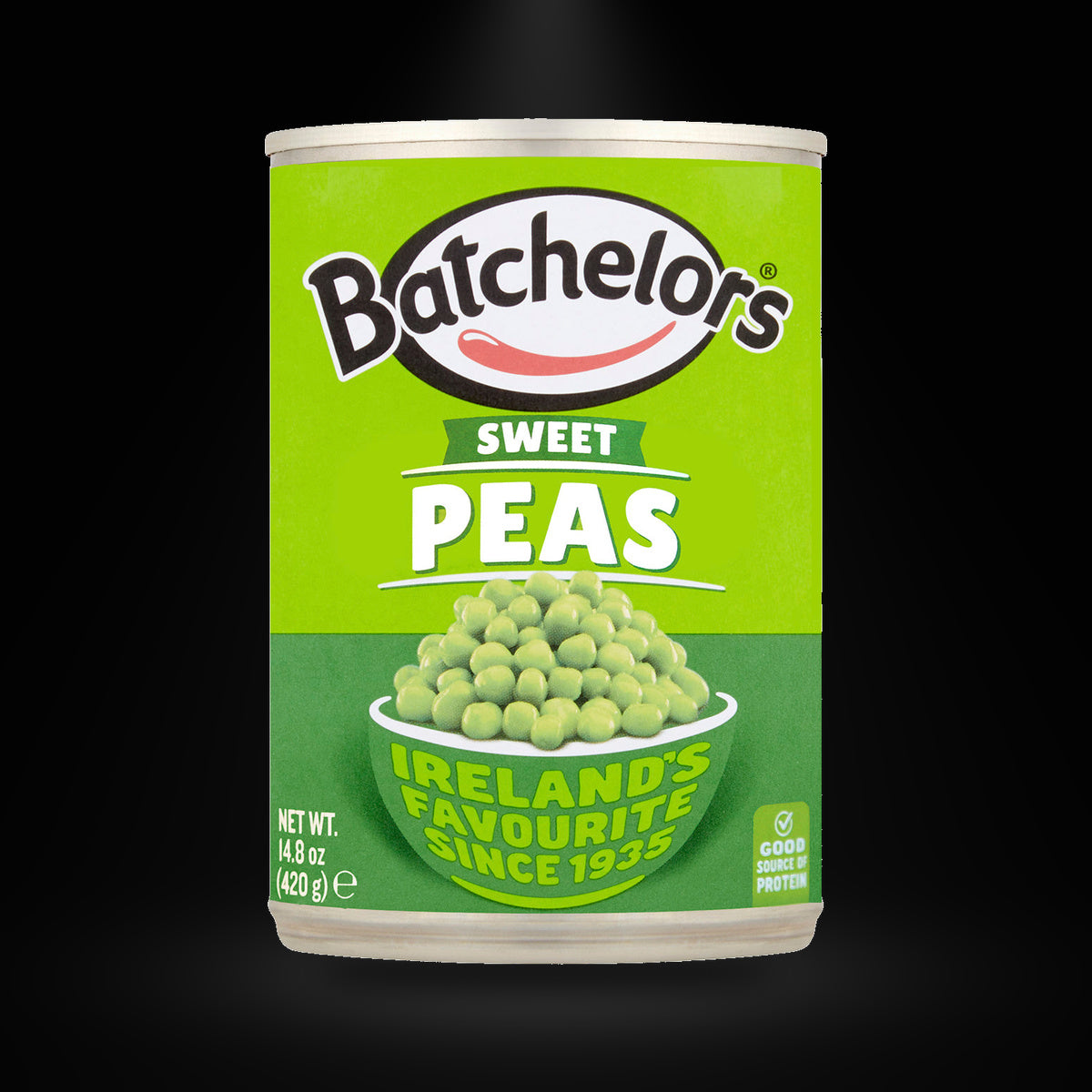 Batchelors Irish Peas 420 gm on a black background with an overhead spotlight