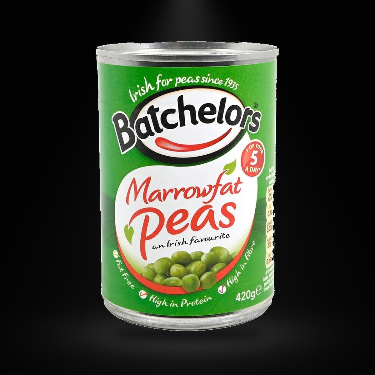 Batchelors Marrowfat Peas 420g on a black background with an overhead spotlight