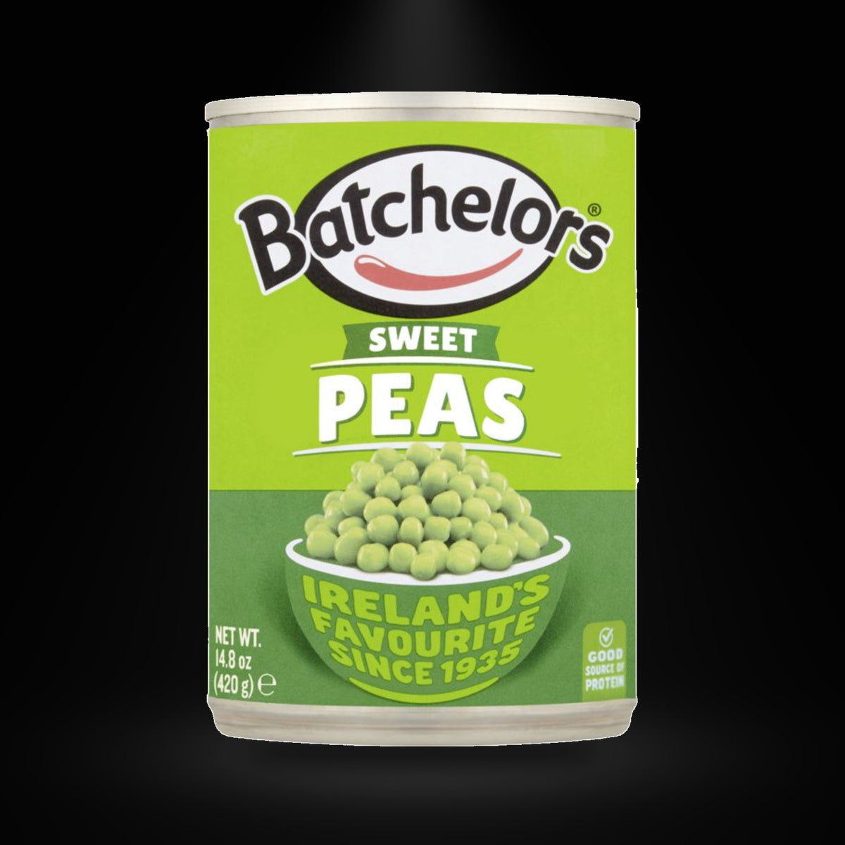 Batchelors Sweet Irish Peas 420g on a black background with an overhead spotlight