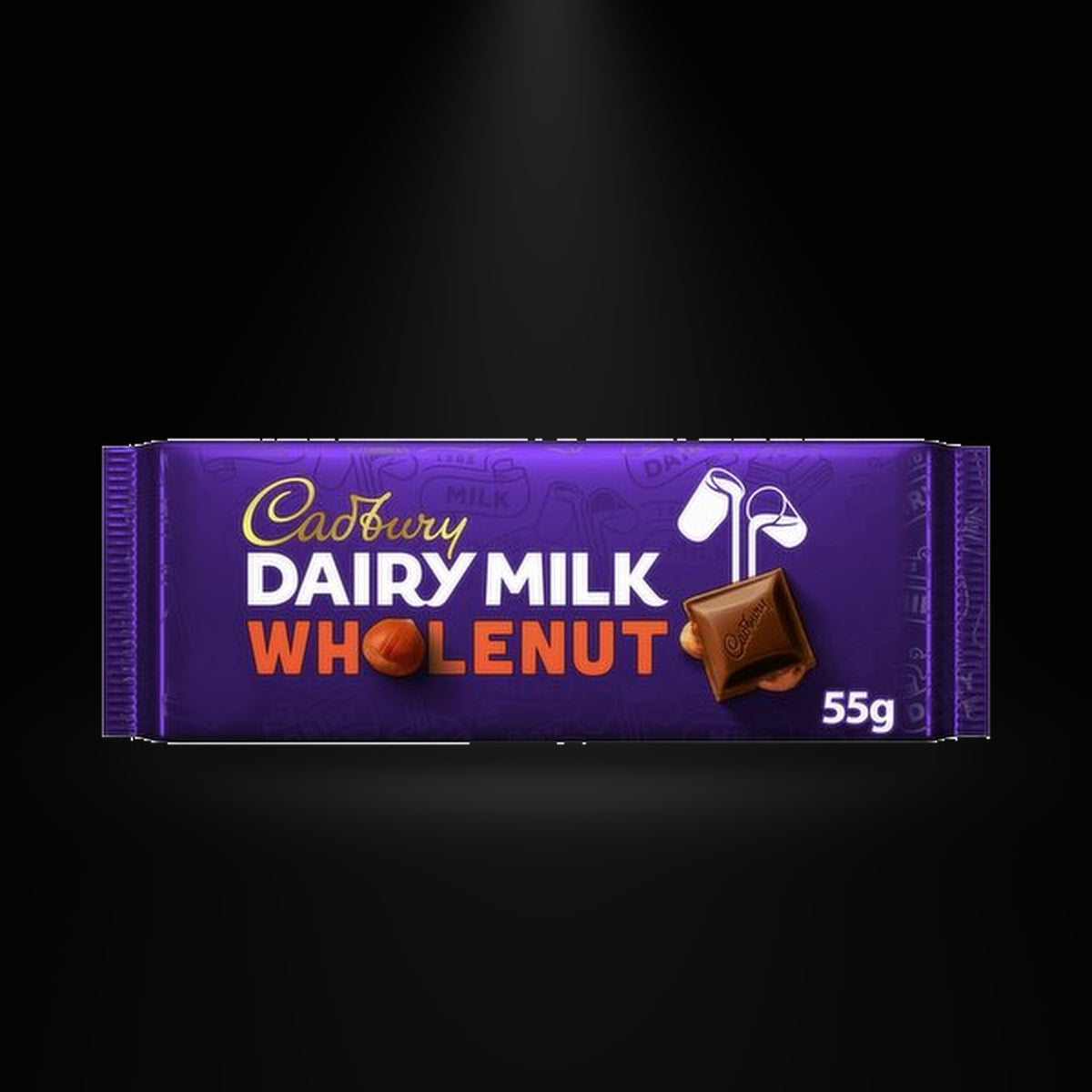 CA Dairy Milk wholenut 55g on a black background with an overhead spotlight