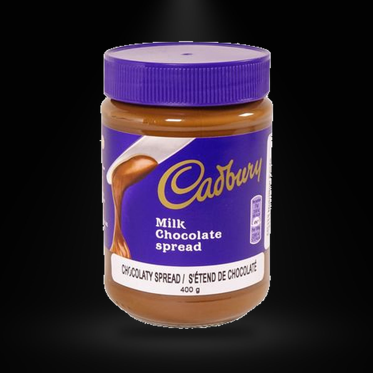Cadbury Chocolate spread on a black background with an overhead spotlight