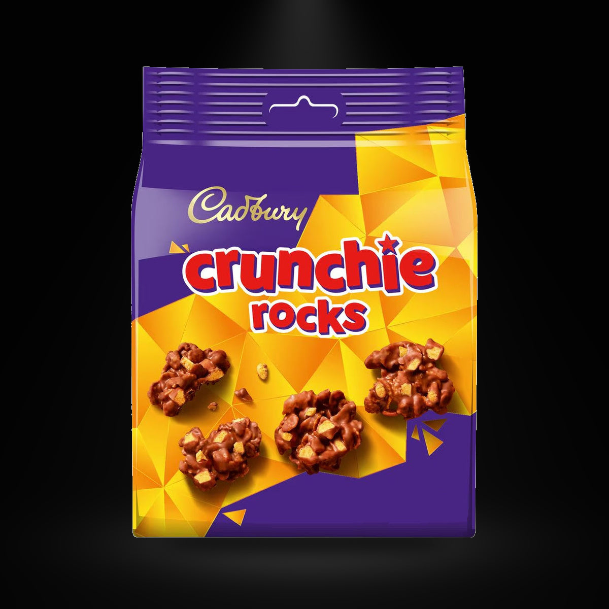 Cadbury Crunchie Rocks 100g on a black background with an overhead spotlight