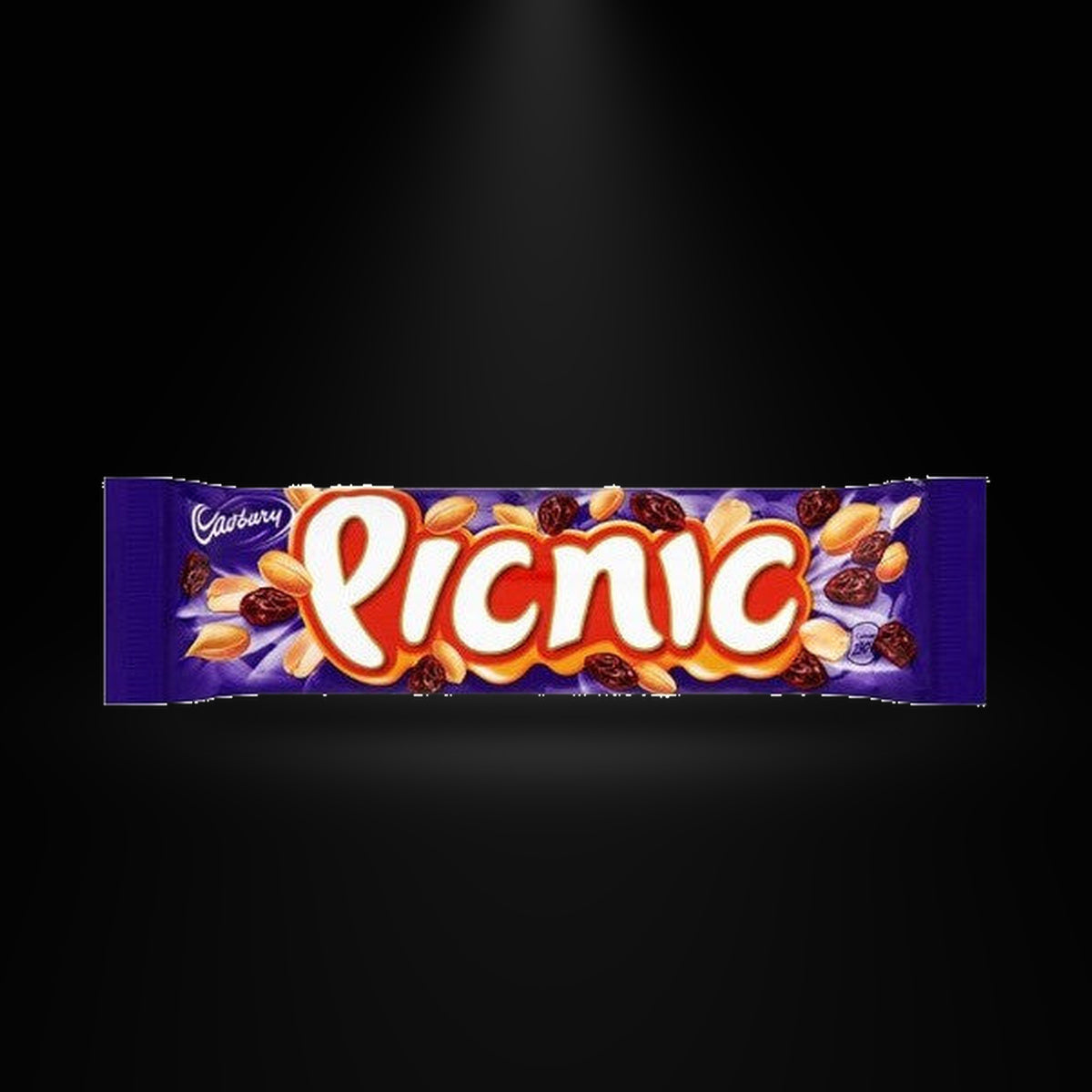 Cadbury Picnic Bar 48g on a black background with an overhead spotlight