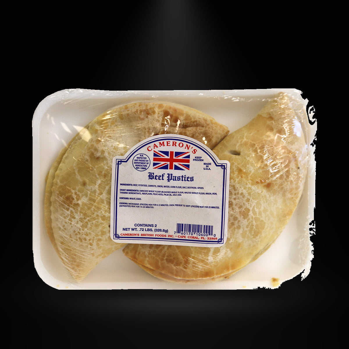 Cameron Beef Pasties on a black background with an overhead spotlight