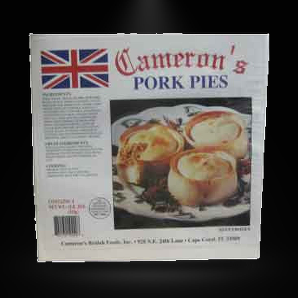 Cameron's Pork pies 4 pk on a black background with an overhead spotlight