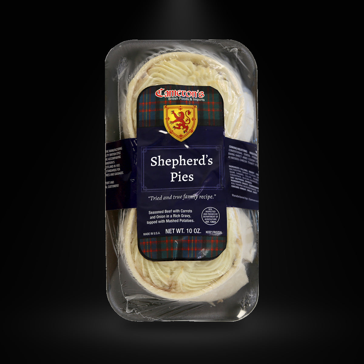 Cameron's Shepherds Pie on a black background with an overhead spotlight