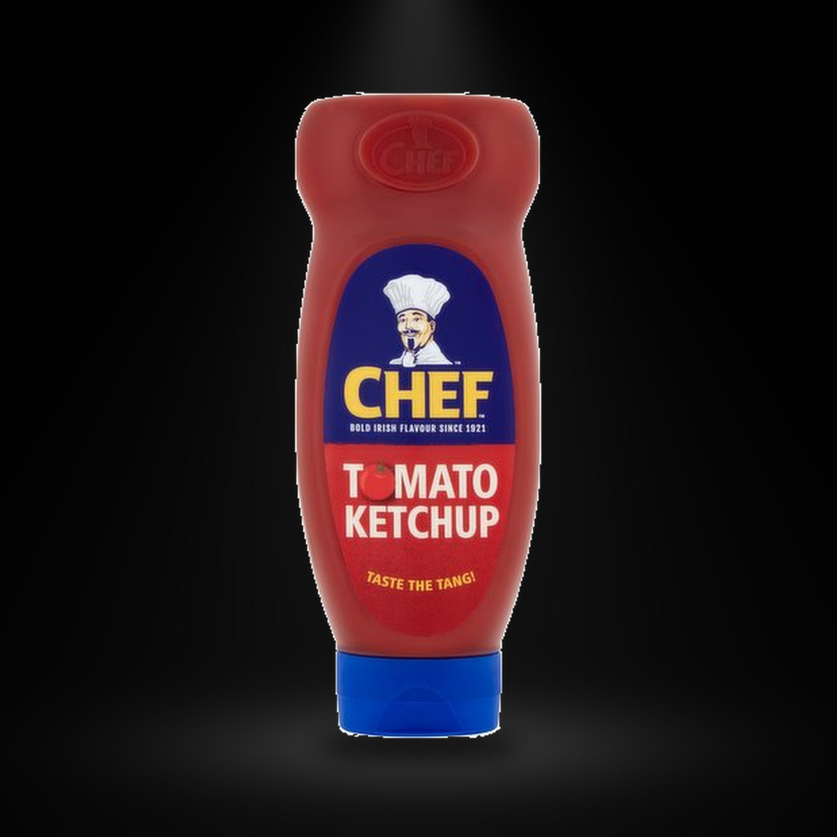 Chef Ketchup 740 gm on a black background with an overhead spotlight