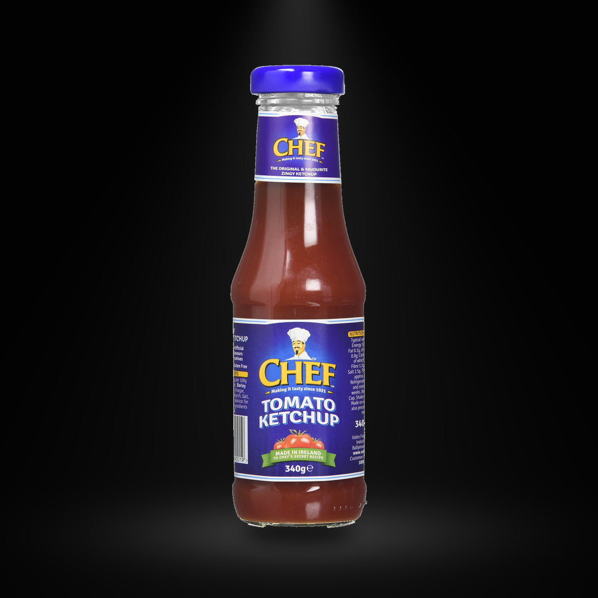 Chef Tomato Ketchup 340g on a black background with an overhead spotlight