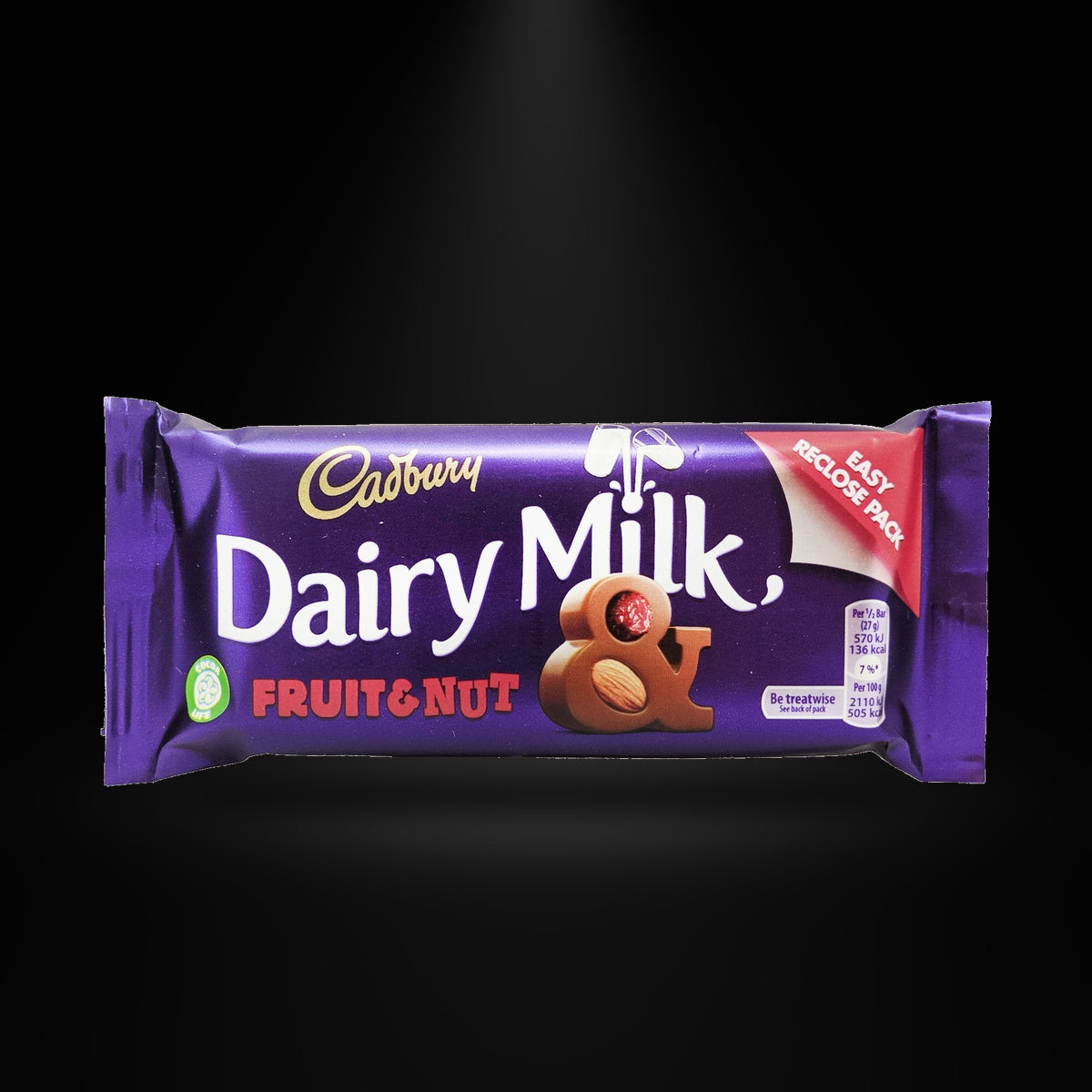 Dairy milk Fruit&Nut 54G on a black background with an overhead spotlight