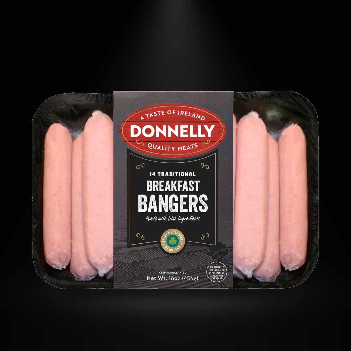 Donelly Traditional Breakfast Bangers on a black background with an overhead spotlight