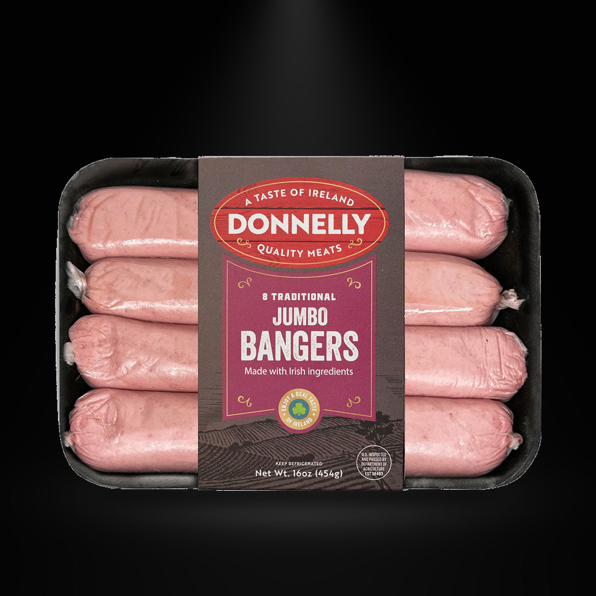 Donnelly jumbo bangers on a black background with an overhead spotlight