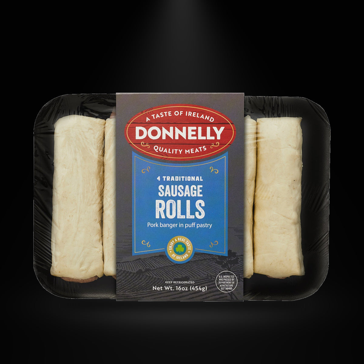 Donnelly Sausage Rolls on a black background with an overhead spotlight