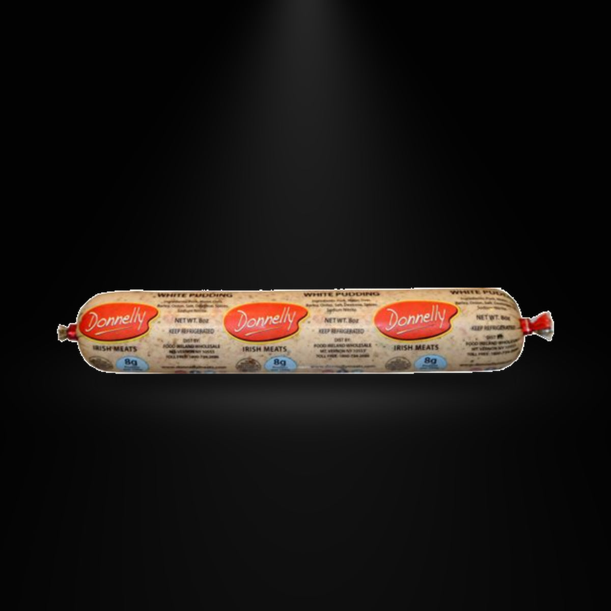 Donnelly White Pudding on a black background with an overhead spotlight