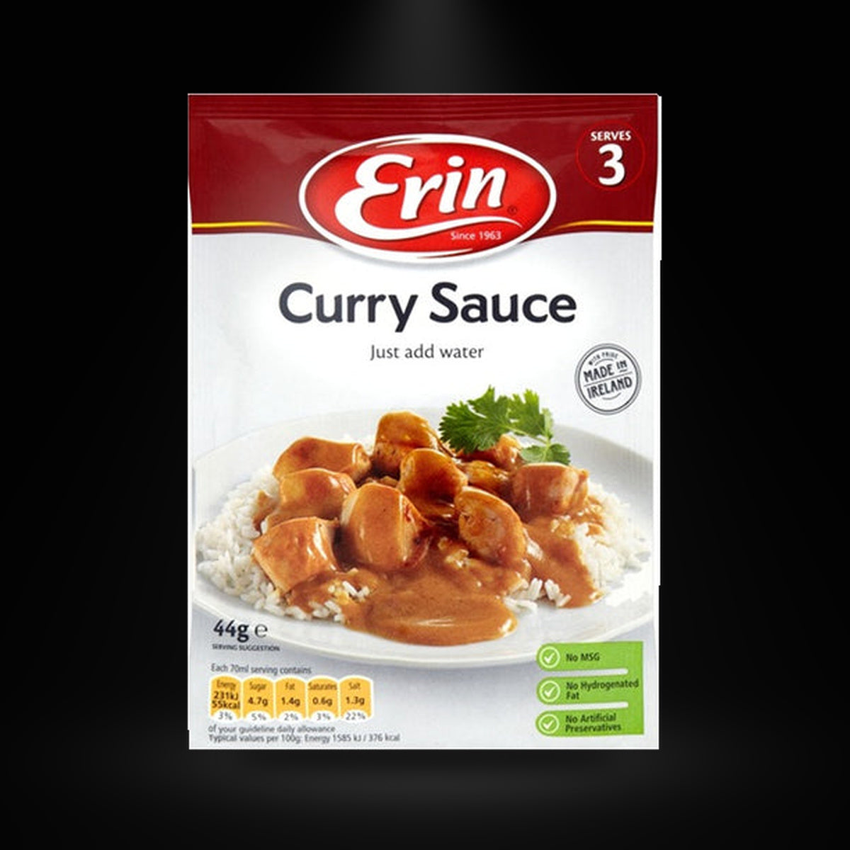 Erin Curry Sauce 1pk on a black background with an overhead spotlight