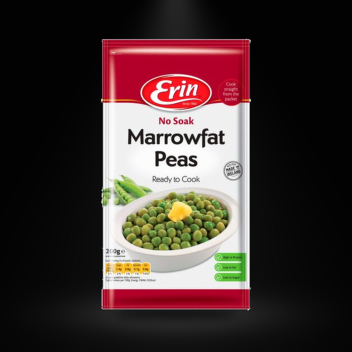 Erin no soak peas on a black background with an overhead spotlight