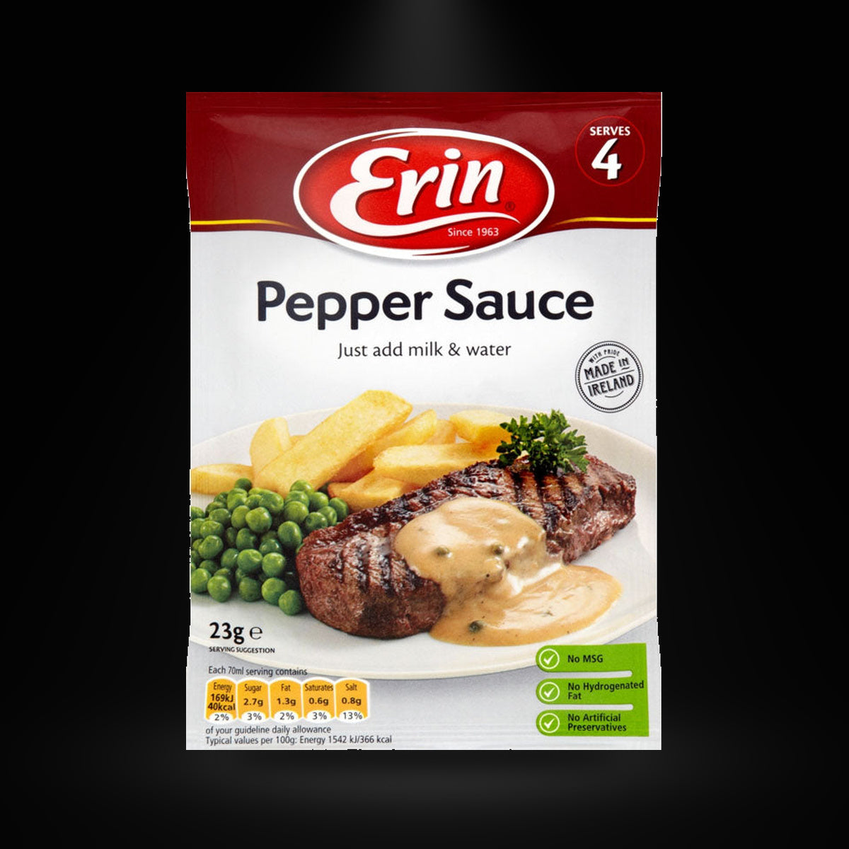 Erin Pepper Sauce on a black background with an overhead spotlight