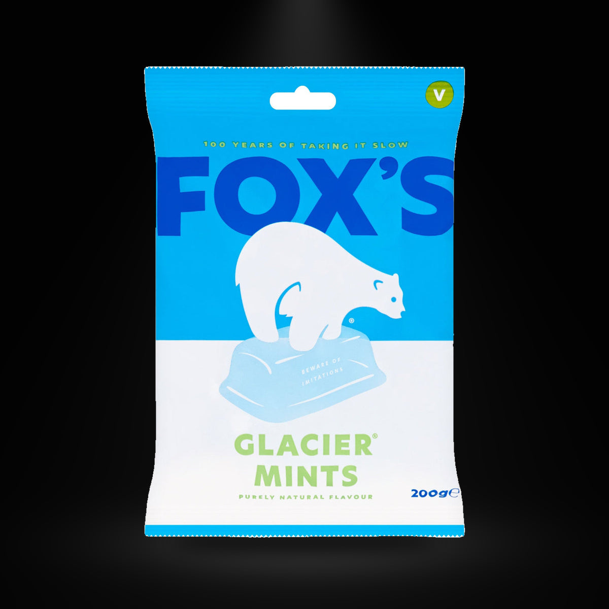Fox's Glacier Mints 200g on a black background with an overhead spotlight