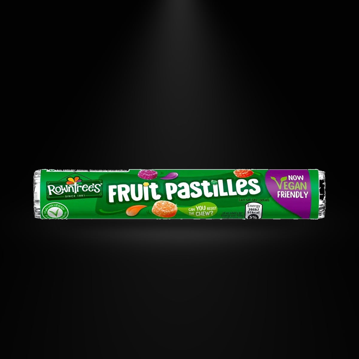 Fruit Pastilles Roll on a black background with an overhead spotlight