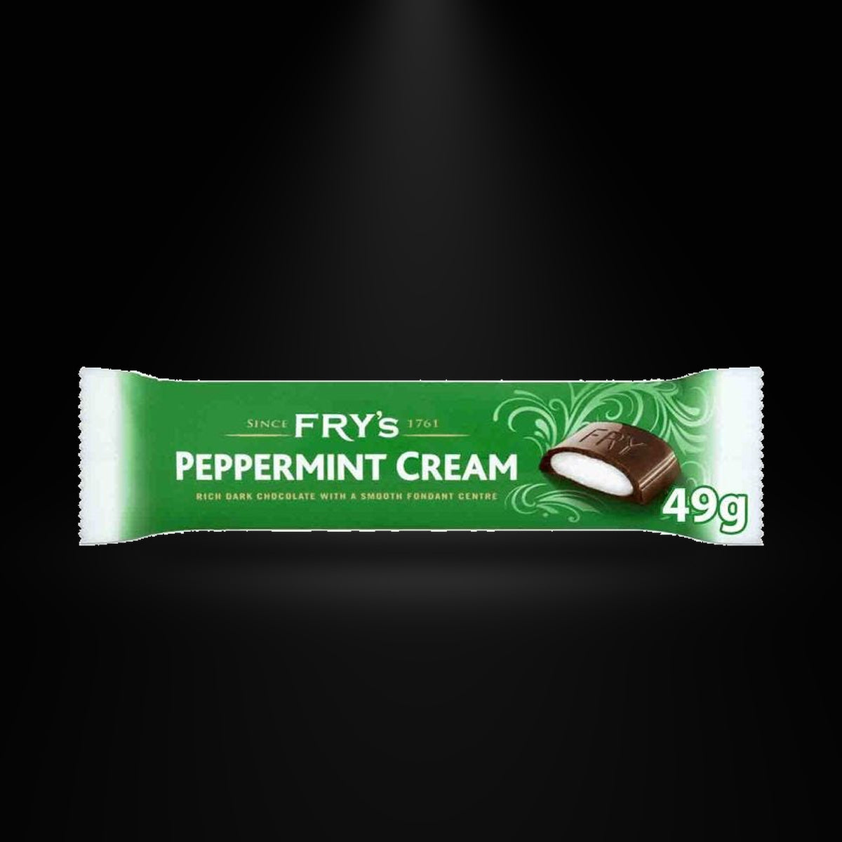 Fry's Peppermint Cream 49gm on a black background with an overhead spotlight