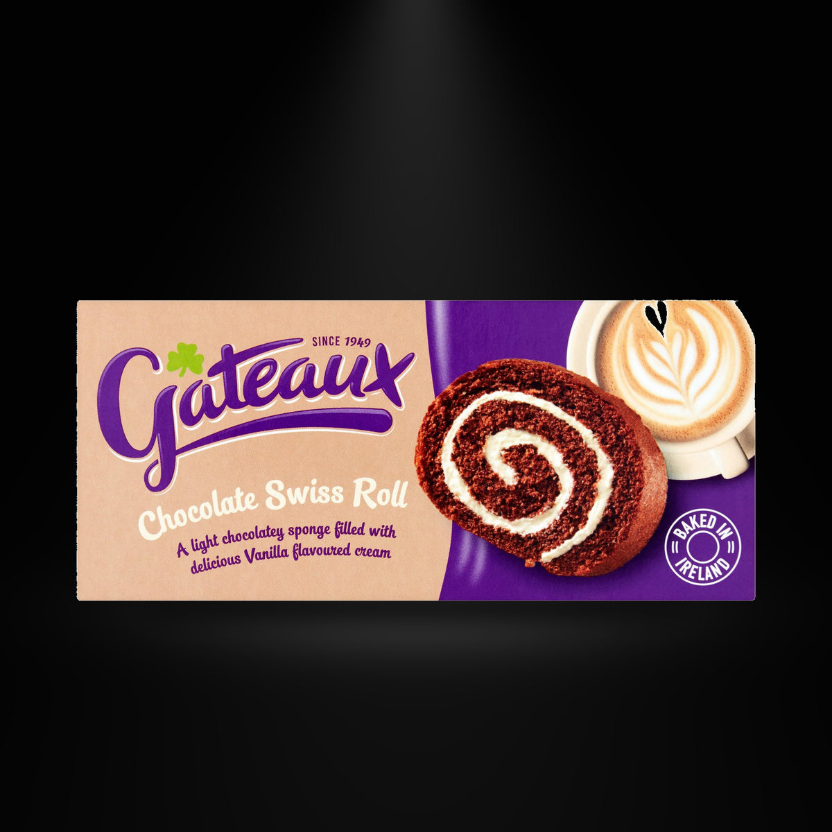 Gateaux Swiss Roll on a black background with an overhead spotlight