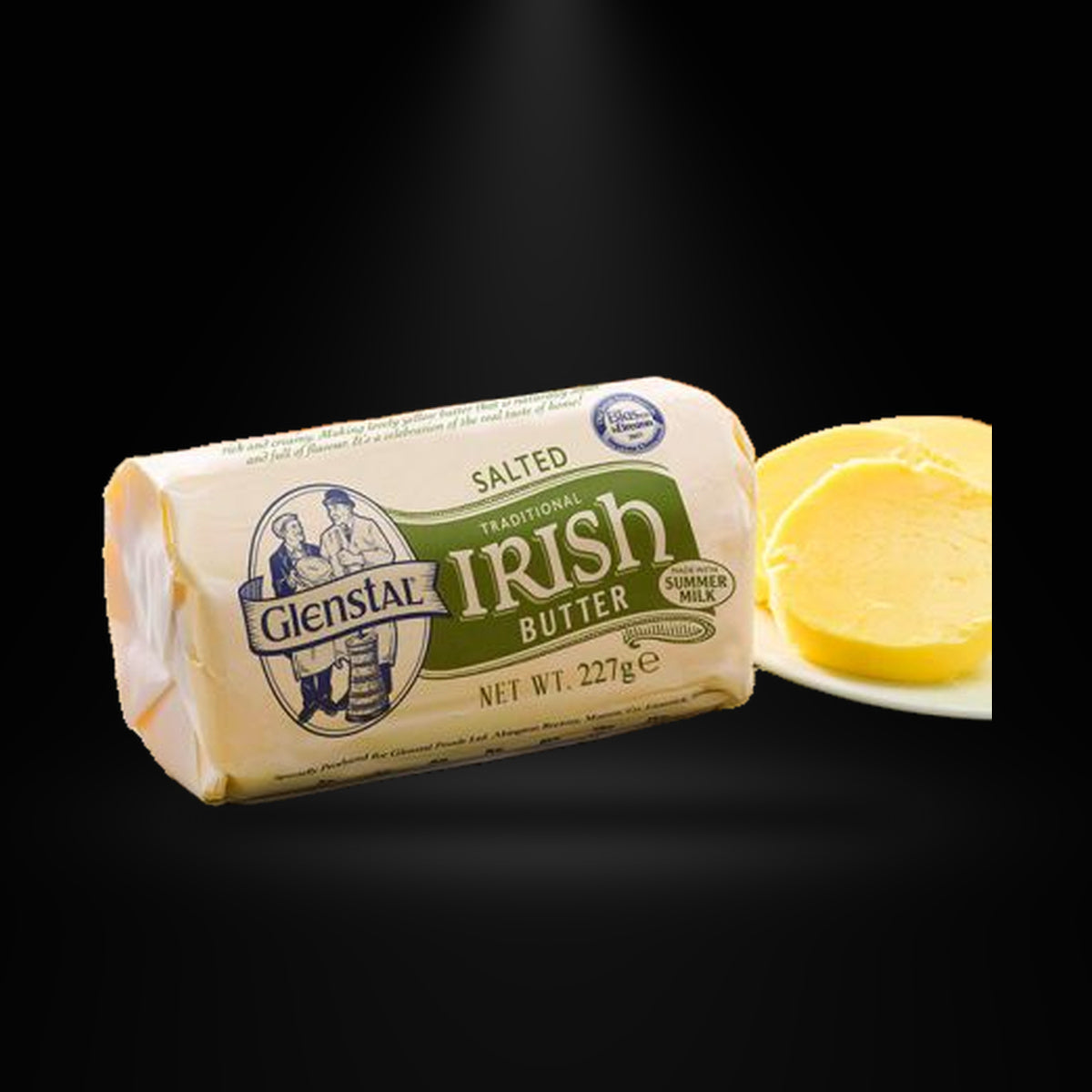 Glenstal butter on a black background with an overhead spotlight
