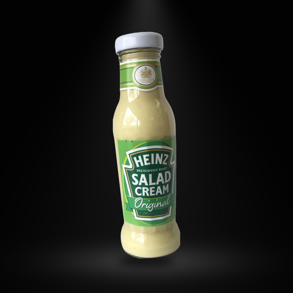 Heinz Salad Cream 285G on a black background with an overhead spotlight