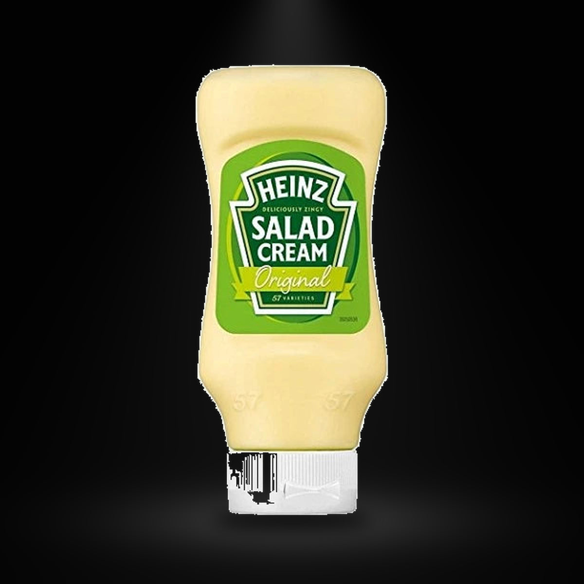 Heinz Salad Cream on a black background with an overhead spotlight