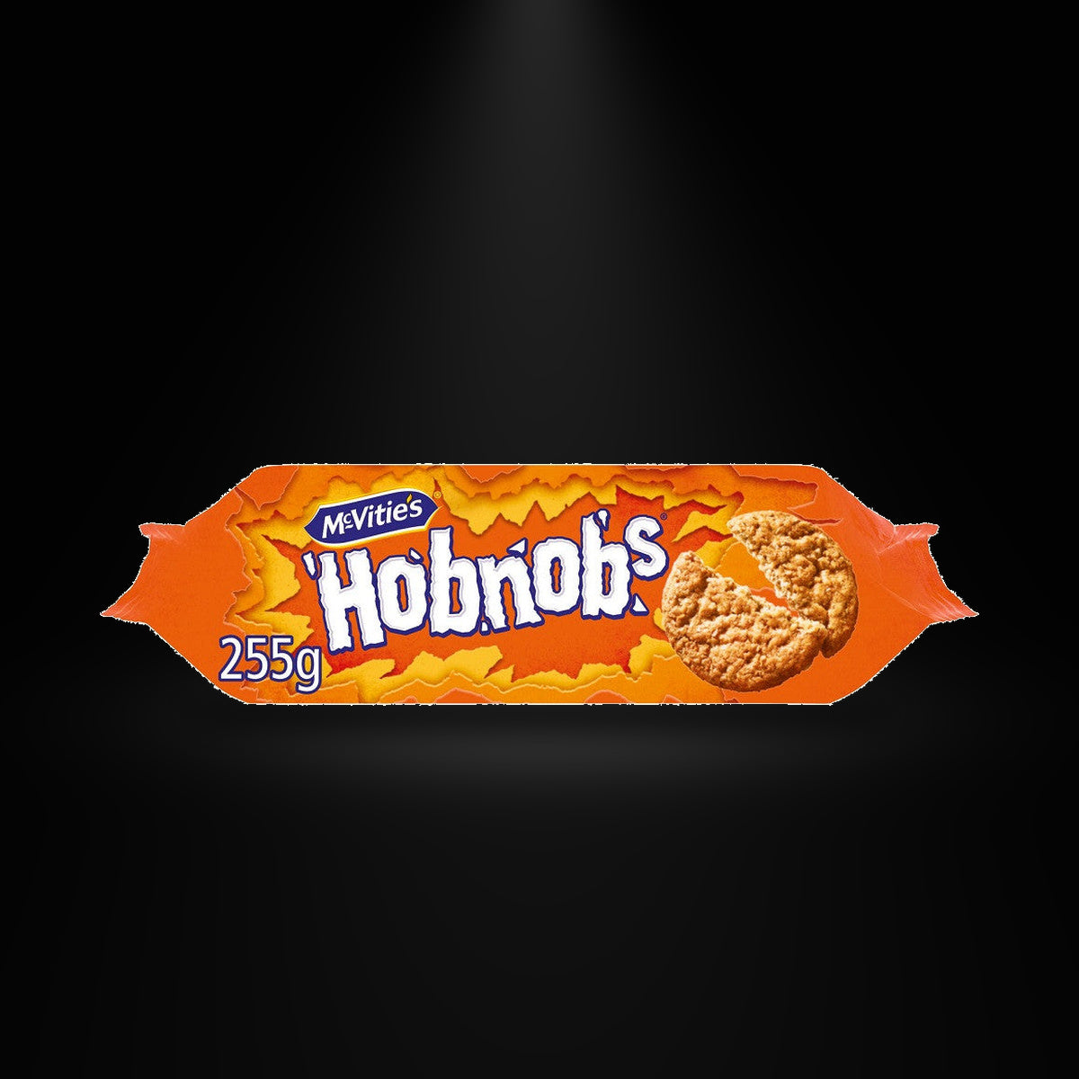 Hobnobs Original on a black background with an overhead spotlight