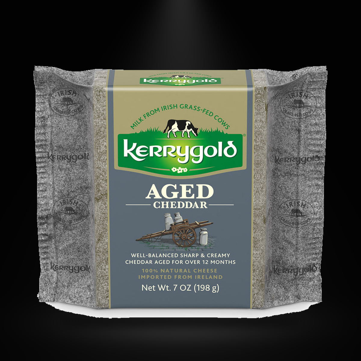 Kerrygold aged Cheddar on a black background with an overhead spotlight