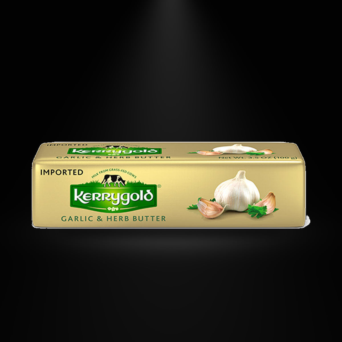 Kerrygold: Garlic & Herb Butter on a black background with an overhead spotlight