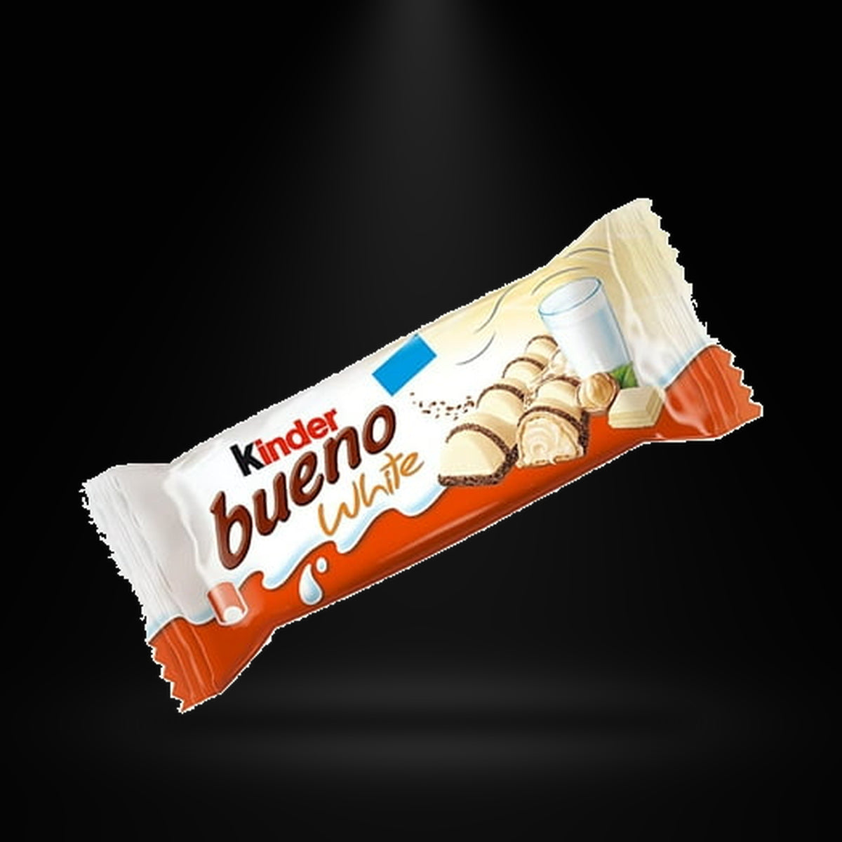 Kinder Bueno white on a black background with an overhead spotlight