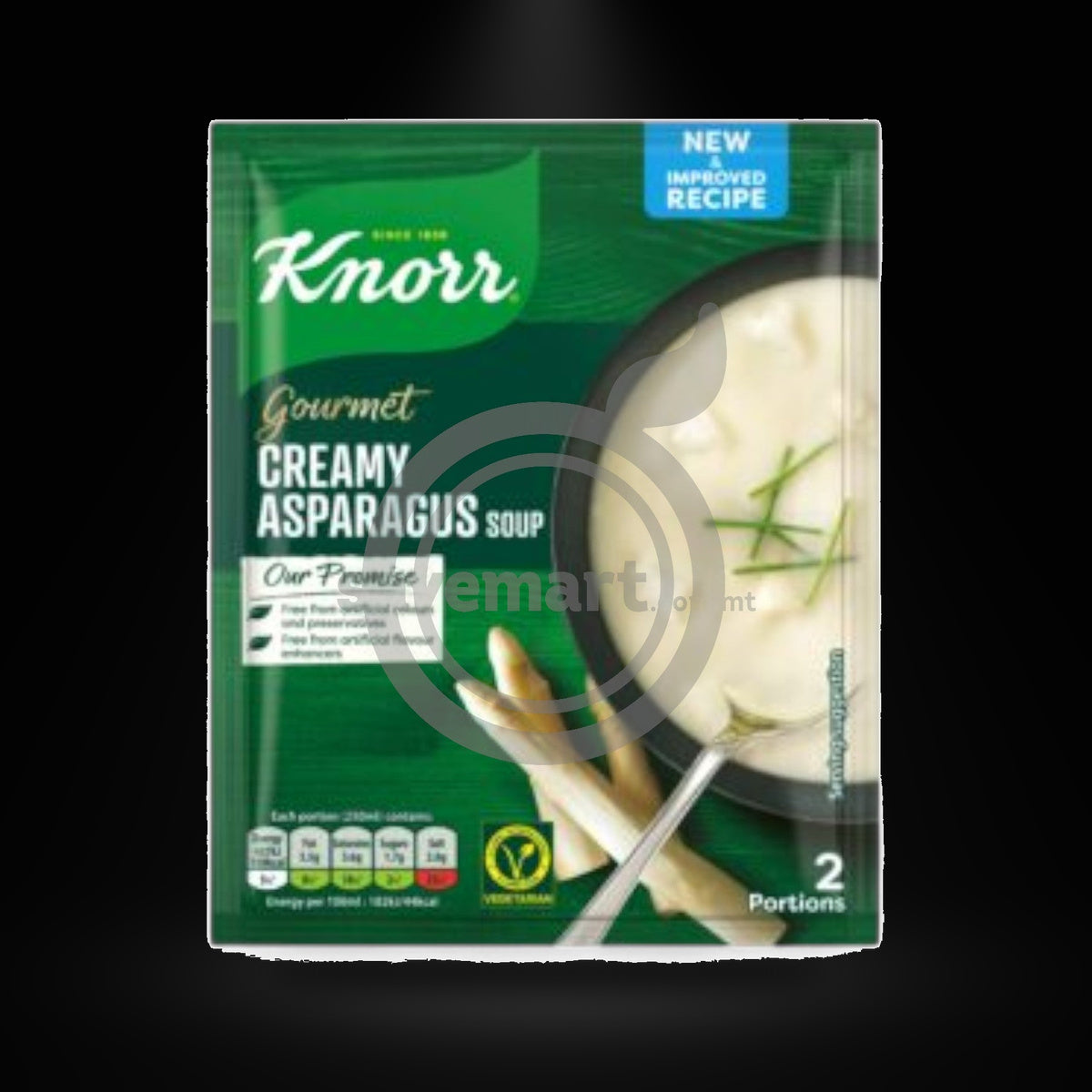 Knorr Creamy Asparagus Soup on a black background with an overhead spotlight