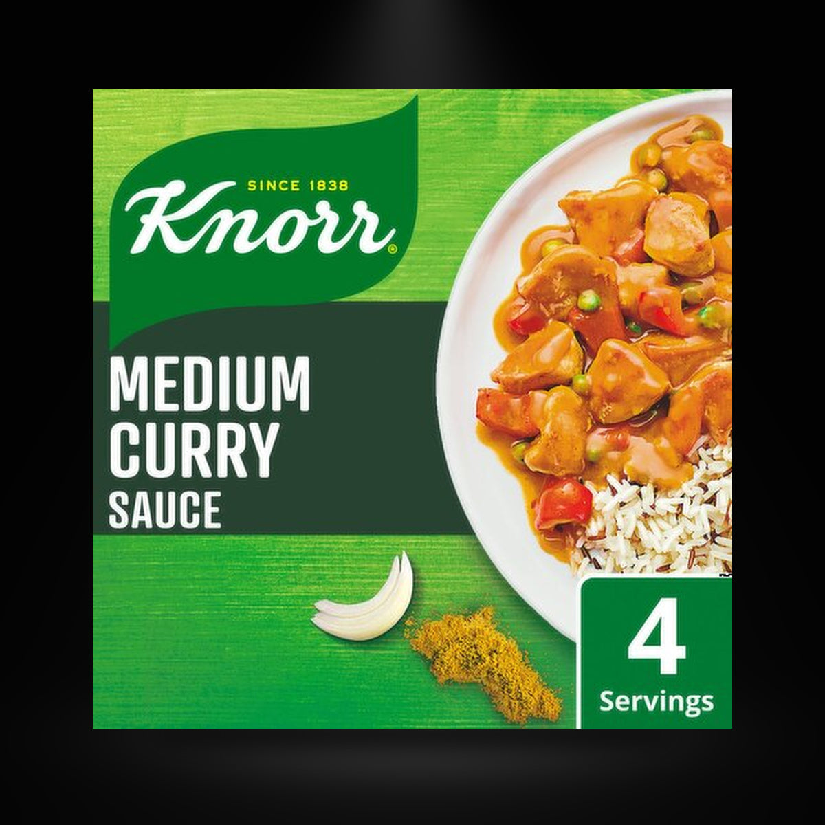 Knorr Medium Curry on a black background with an overhead spotlight