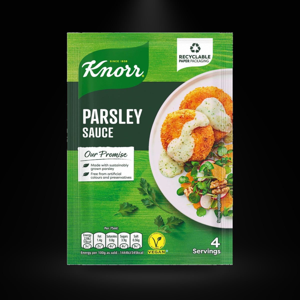 Knorr parsley sauce on a black background with an overhead spotlight