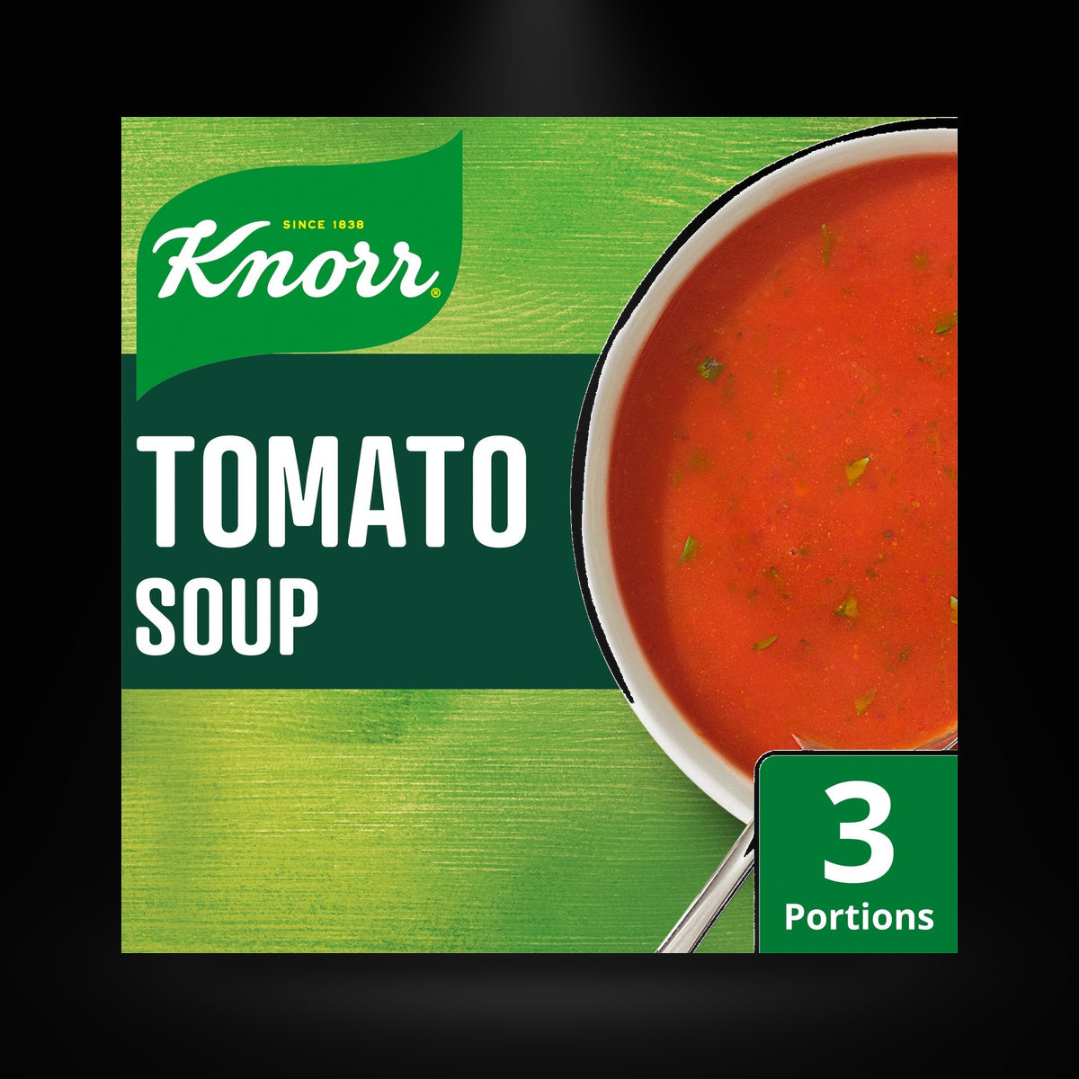 Knorr Tomato Soup 77G on a black background with an overhead spotlight