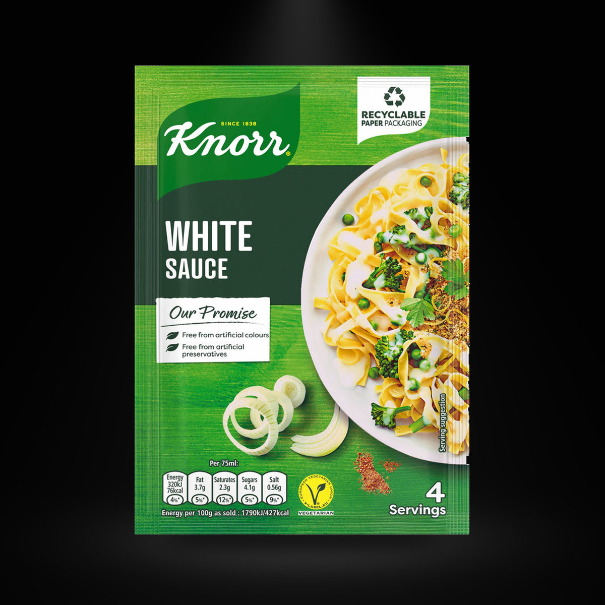 Knorr white sauce on a black background with an overhead spotlight