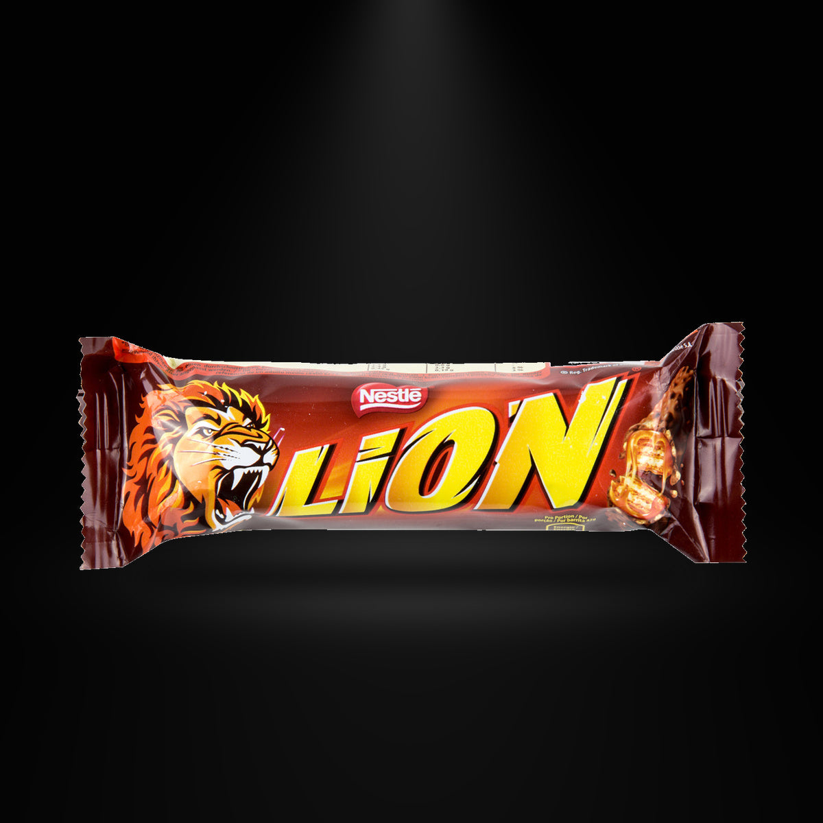 Lion Bar 50G on a black background with an overhead spotlight