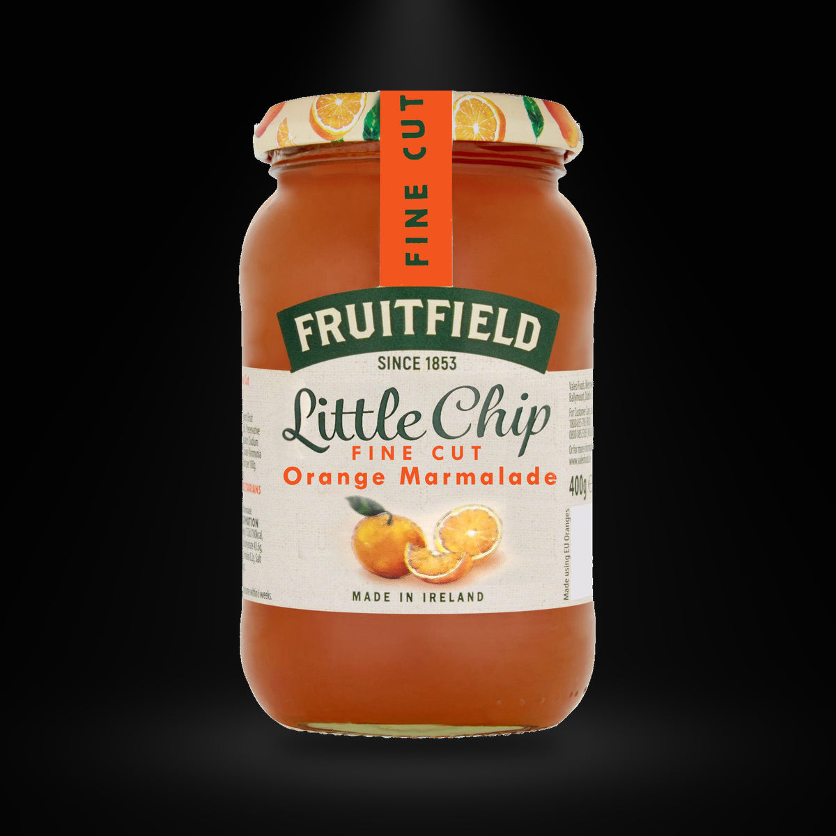 Little Chip Fine Cut Orange Marmalade on a black background with an overhead spotlight