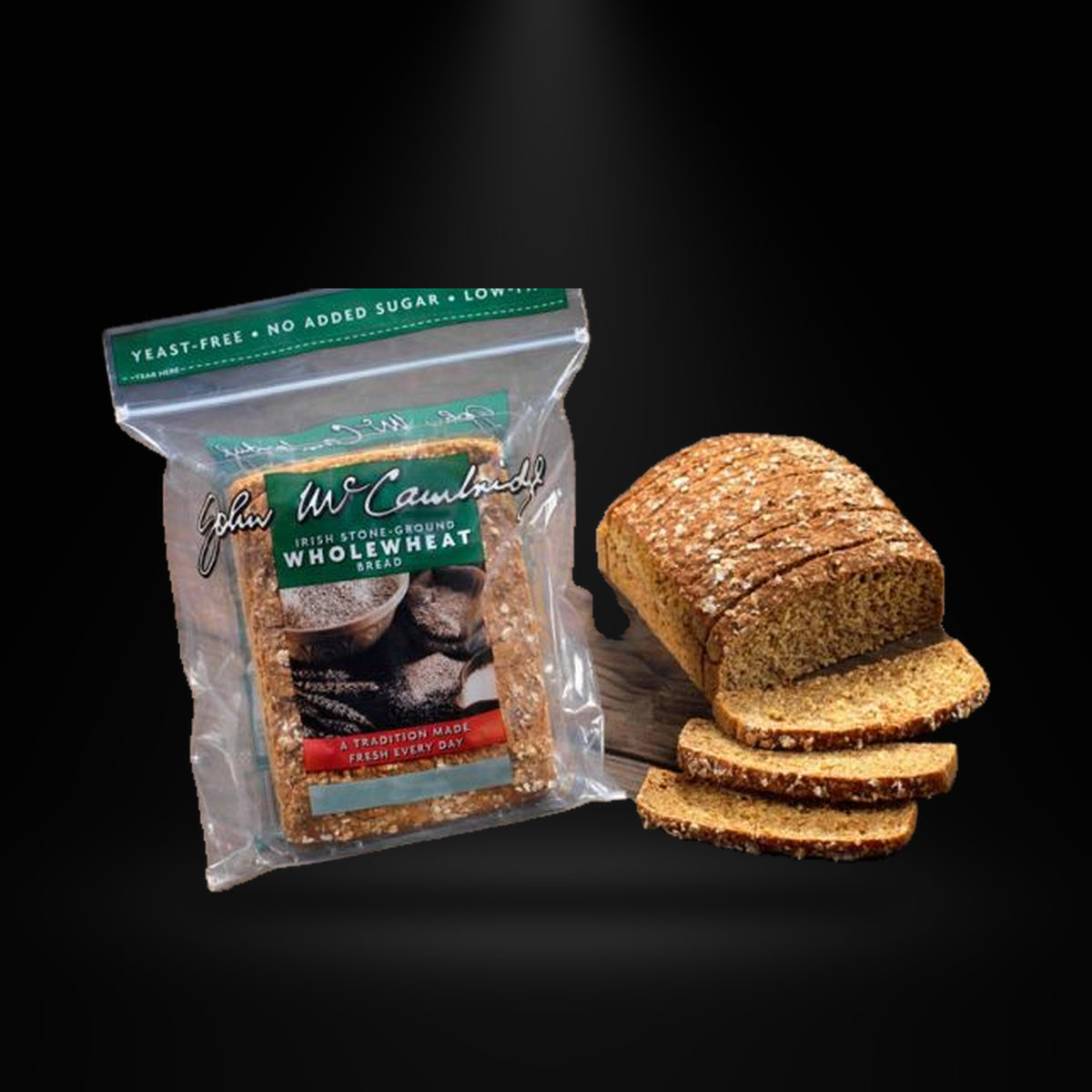 Maccambridge Soda Bread on a black background with an overhead spotlight
