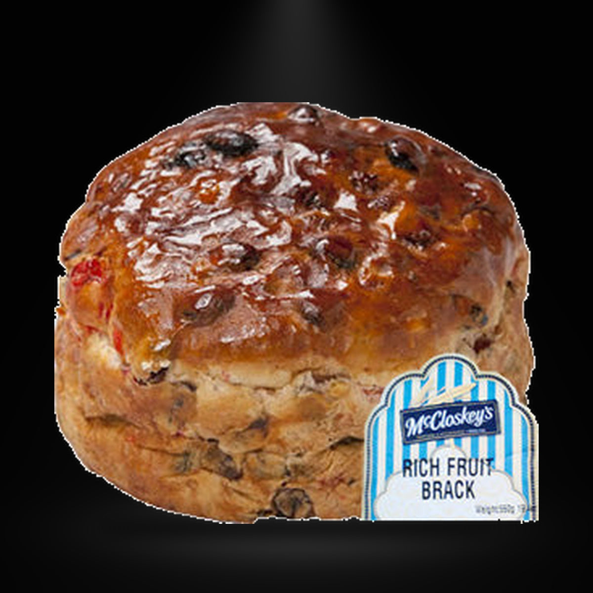 Mc Closkey's Rich Fruit Brack 550G on a black background with an overhead spotlight