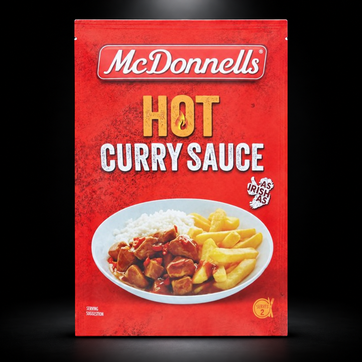 McDonnells Hot Curry Sauce on black background with overhead spotlight