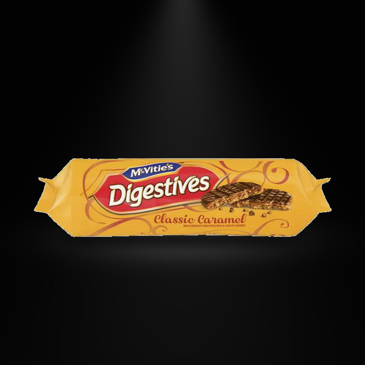 McVities Digestives Caramel on a black background with an overhead spotlight