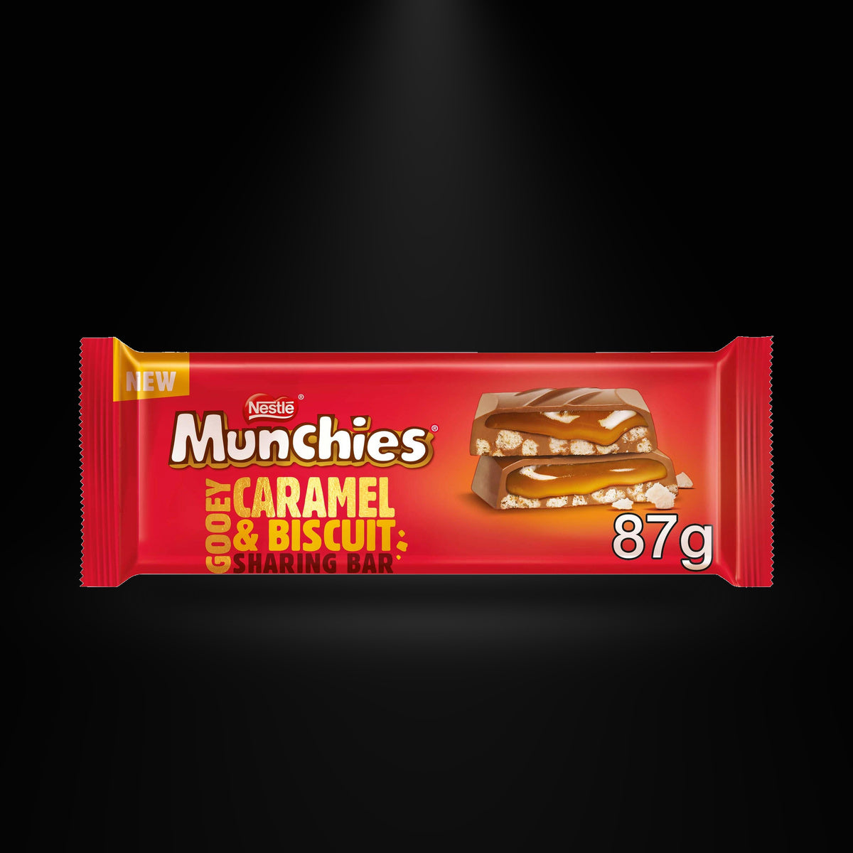 Munchies caramel biscuit on a black background with an overhead spotlight