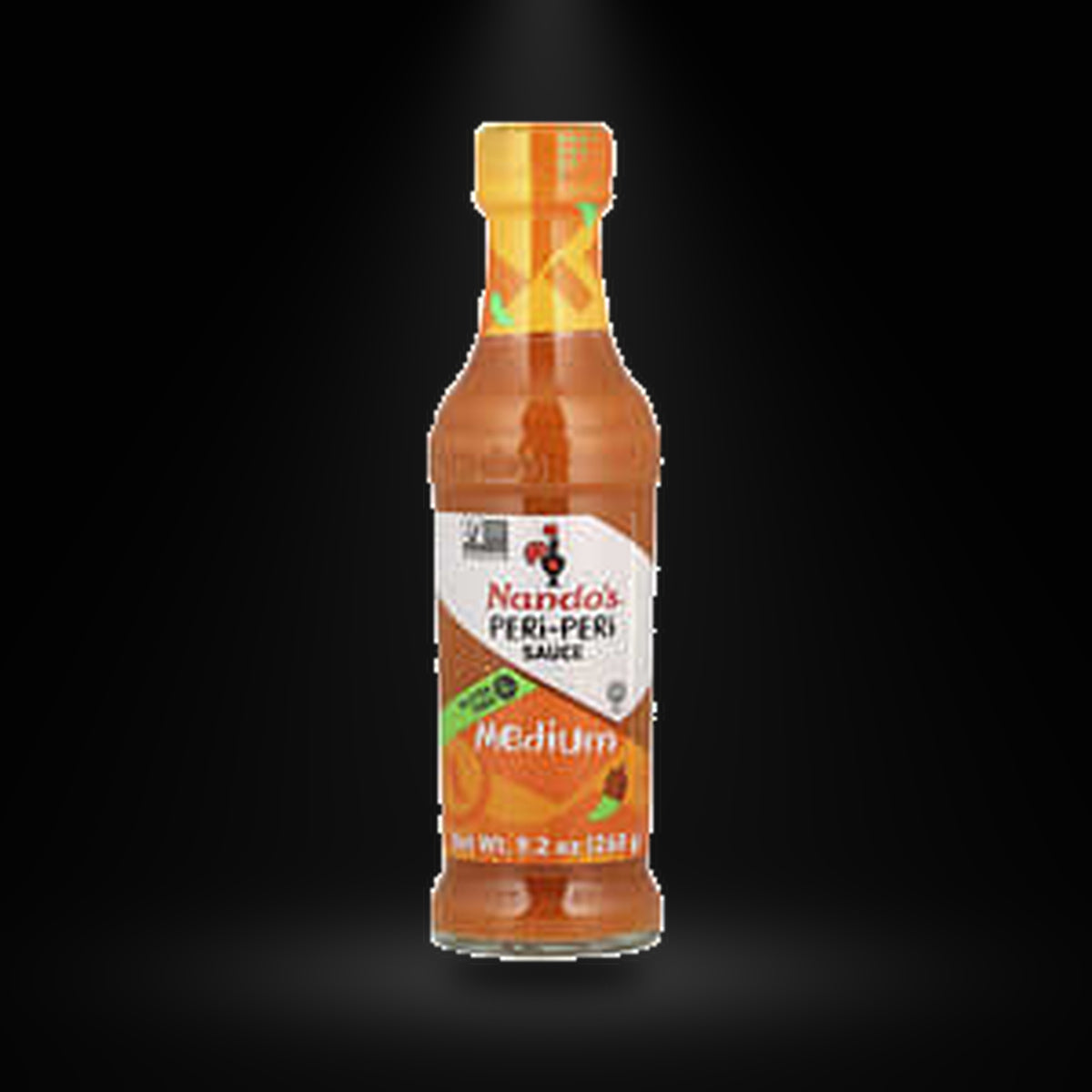 Nando's Peri Peri medium sauce 260G on a black background with an overhead spotlight