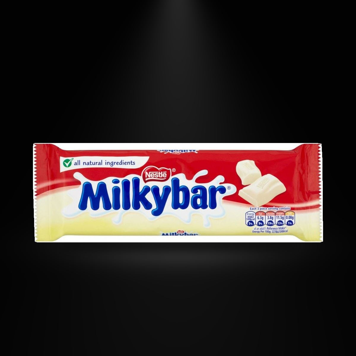 nestle milkybar 90gm on a black background with an overhead spotlight